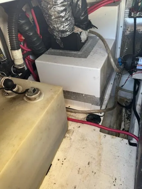 Slide: The Image of Engine compartment of a 2014 Regal 28 Express boat, showing wiring and components. - 27