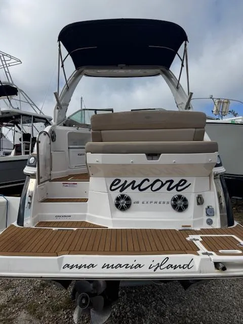 Slide: The Image of 2014 Regal 28 Express boat with "Encore" name, docked at Anna Maria Island. - 3