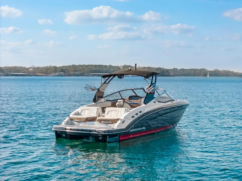 Slide: The Image of 2017 Chaparral 257 SSX Surf Edition boat on a serene lake. - 1
