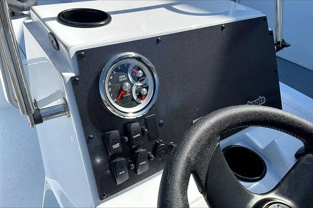 Slide: The Image of Dashboard of 2025 Xpress Boats H210 BAY with steering wheel and gauges. - 11