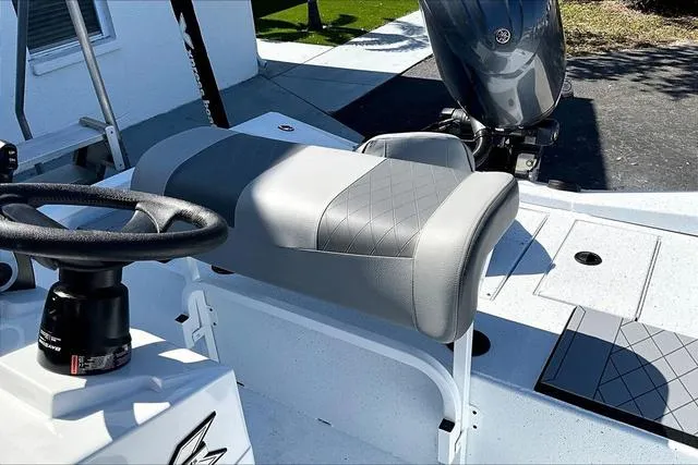 Slide: The Image of 2025 Xpress Boats H210 BAY interior with steering wheel and seating. - 12