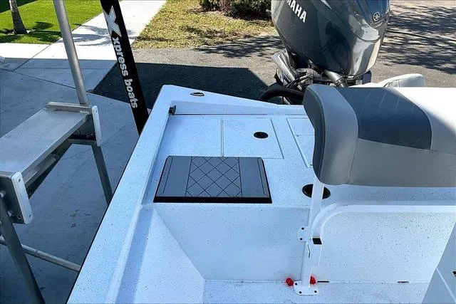Slide: The Image of 2025 Xpress Boats H210 BAY deck with seating and Yamaha motor. - 14