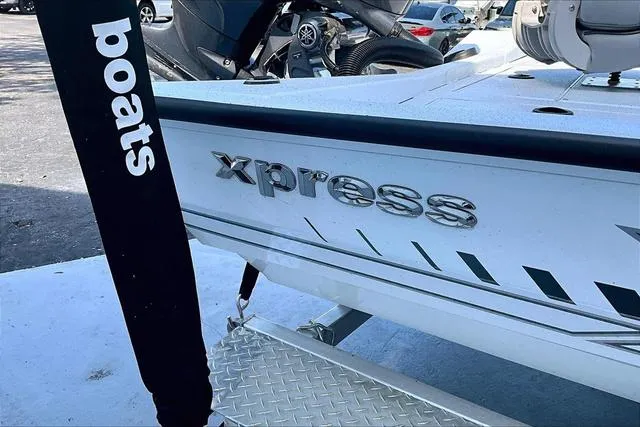 Slide: The Image of 2025 Xpress Boats H210 BAY, close-up of logo and design details. - 17