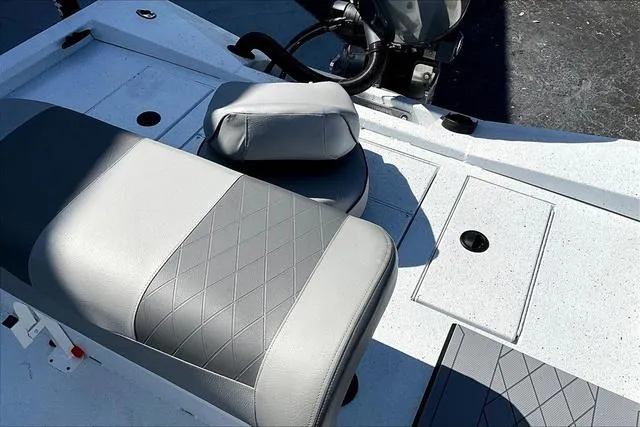 Slide: The Image of 2025 Xpress Boats H210 BAY interior with gray seating and storage compartments. - 22