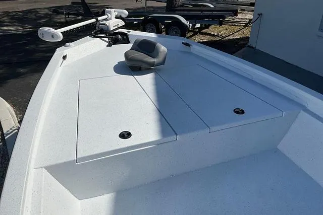 Slide: The Image of 2025 Xpress Boats H210 BAY deck with storage compartments and trolling motor. - 25