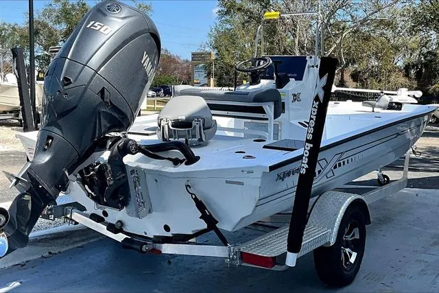Slide: The Image of 2025 Xpress Boats H210 BAY with Yamaha 150 engine, parked on a trailer. - 6
