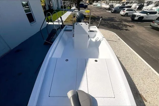 Slide: The Image of 2025 Xpress Boats H210 BAY, white deck, parked outdoors. - 8