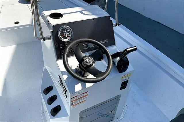 Slide: The Image of 2025 Xpress Boats H210 BAY steering console with controls and gauges. - 9