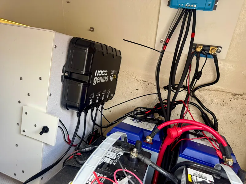 Slide: The Image of Battery setup with NOCO Genius charger in 2021 Prowler 31 boat. - 19