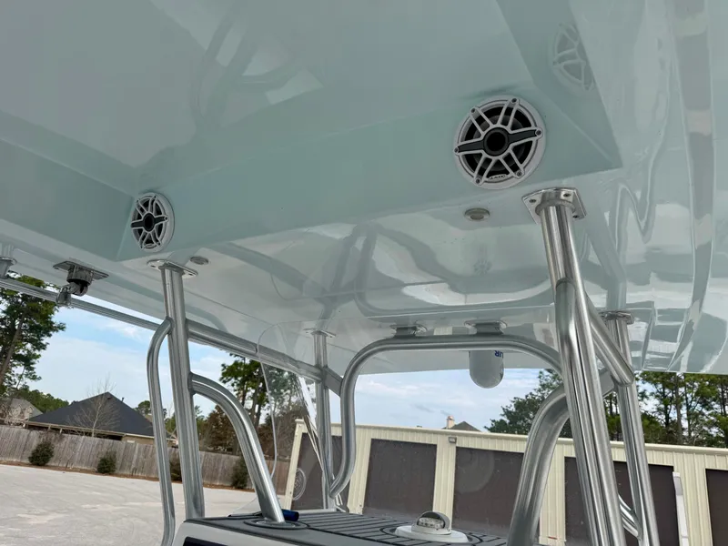 Slide: The Image of 2021 Prowler 31 boat with mounted speakers and sturdy metal framework. - 23