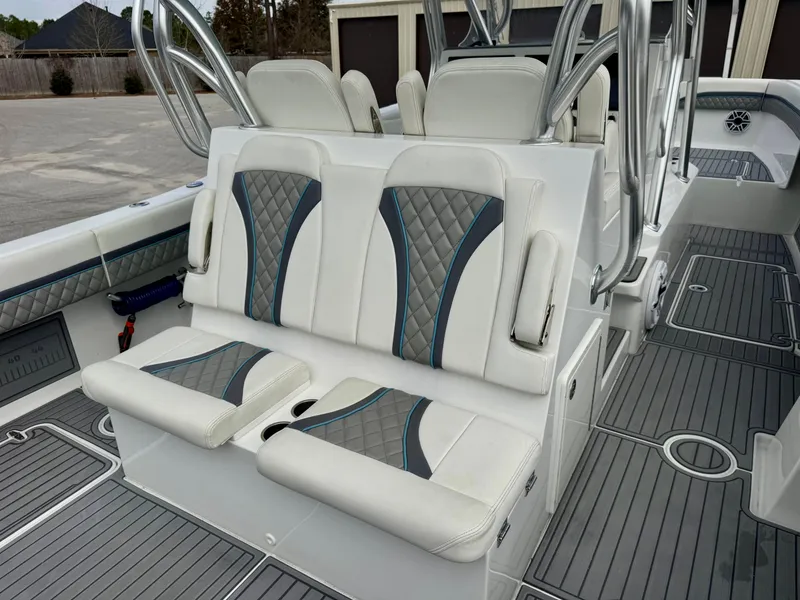 Slide: The Image of 2021 Prowler Prowler 31 boat interior with white and gray seating, modern design. - 28
