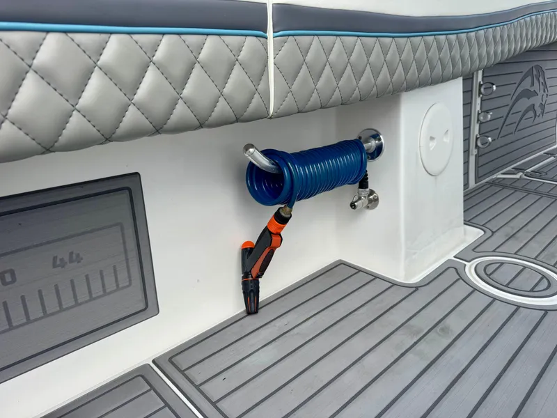 Slide: The Image of Interior of 2021 Prowler 31 boat with coiled blue rope and quilted seating. - 32