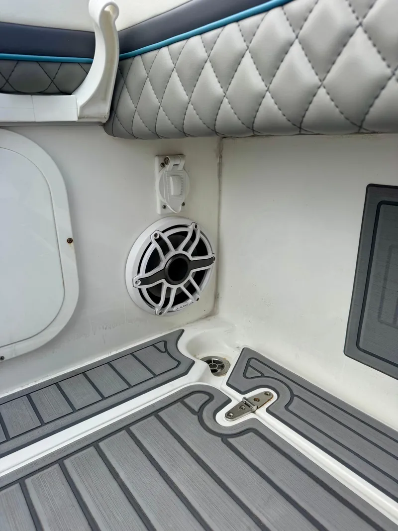 Slide: The Image of Interior of 2021 Prowler 31 boat with quilted upholstery and speaker. - 33