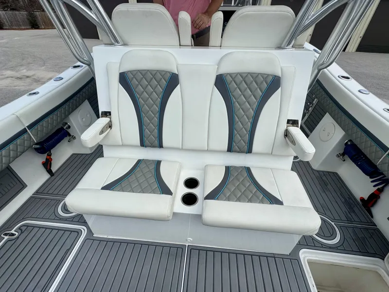 Slide: The Image of 2021 Prowler 31 boat seating with quilted design and cup holders. - 36