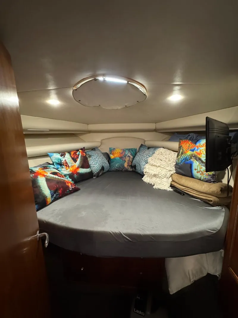 Slide: The Image of Cozy interior cabin of 2002 Riviera Convertible 37 with colorful cushions and modern lighting. - 17