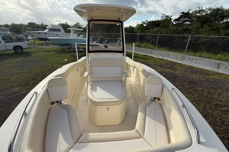 Slide: The Image of 2026 Scout 215 XSF boat with spacious seating and modern design. - 6