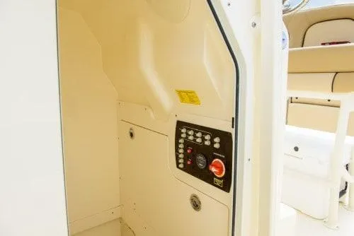 Slide: The Image of 2025 Scout 215 XSF boat interior with control panel and seating area. - 9