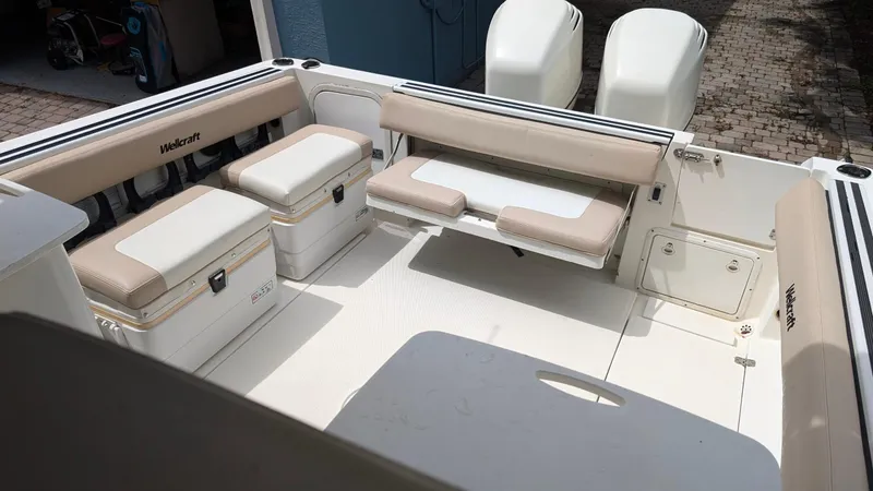 Slide: The Image of 2001 Wellcraft 270 Coastal O/B boat interior with seating and storage compartments. - 7