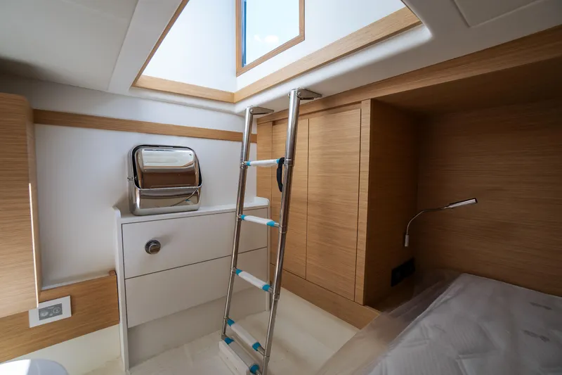 Slide: The Image of Interior of 2025 Pardo Yachts P50, featuring modern wood finish and skylight. - 32