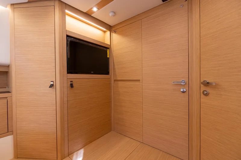 Slide: The Image of Interior of 2025 Pardo Yachts P50, featuring sleek wooden cabinetry and modern design. - 44