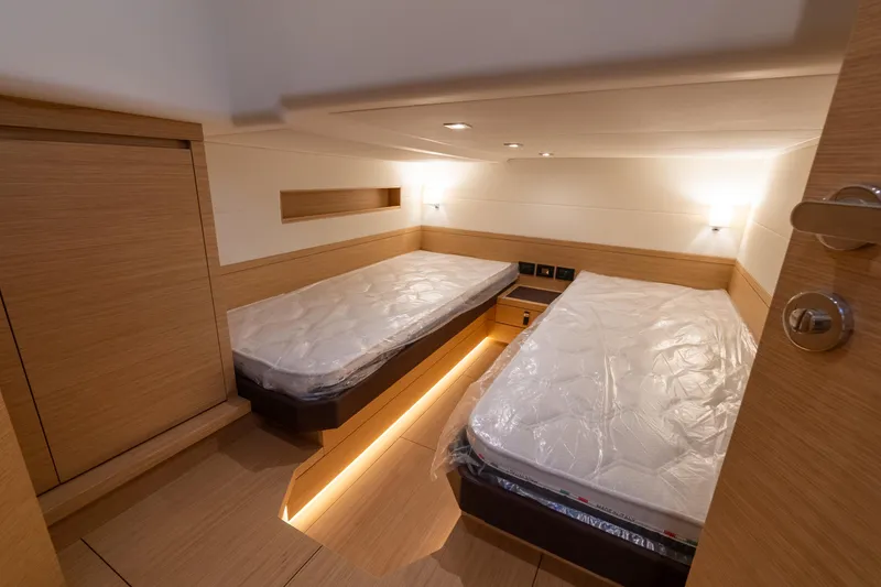 Slide: The Image of 2025 Pardo Yachts P50 cabin with twin beds and modern wooden interior. - 46