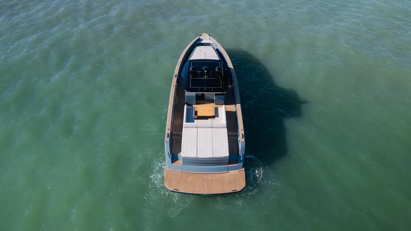 Slide: The Image of 2025 Pardo Yachts P50 cruising on calm green waters, aerial view. - 11