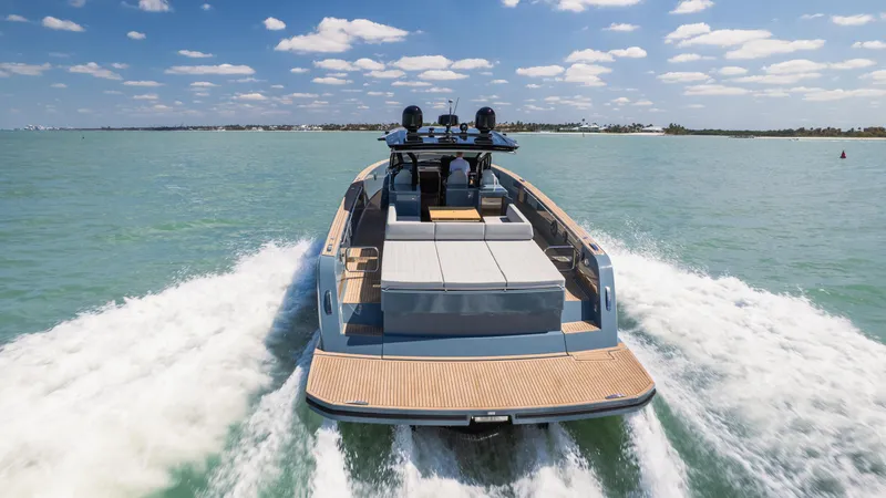 Slide: The Image of 2025 Pardo Yachts P50 cruising on open water under a clear blue sky. - 17