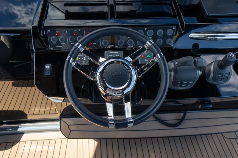 Slide: The Image of Steering wheel and controls of 2025 Pardo Yachts P50, featuring sleek design and advanced technology. - 40