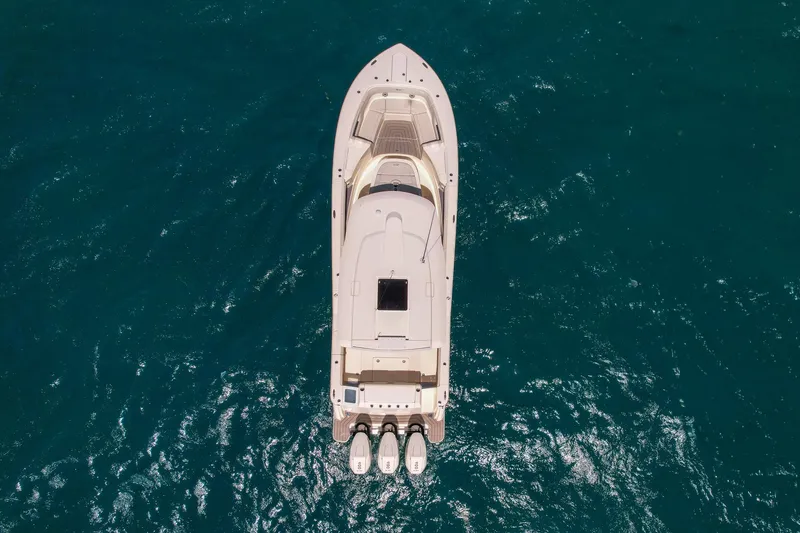 Slide: The Image of Aerial view of 2024 Scout 377 LXF yacht on blue ocean water. - 17