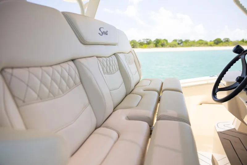 Slide: The Image of Luxurious seating on 2024 Scout 377 LXF boat with scenic water view. - 21