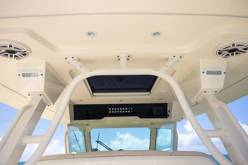 Slide: The Image of 2024 Scout 377 LXF boat interior, featuring modern design and advanced audio system. - 24
