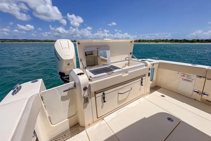 Slide: The Image of 2024 Scout 377 LXF boat with outdoor kitchen and ocean view. - 26