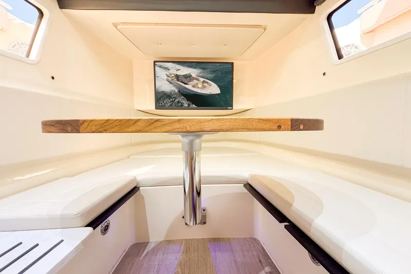 Slide: The Image of 2024 Scout 377 LXF cabin interior with wooden table and seating. - 42