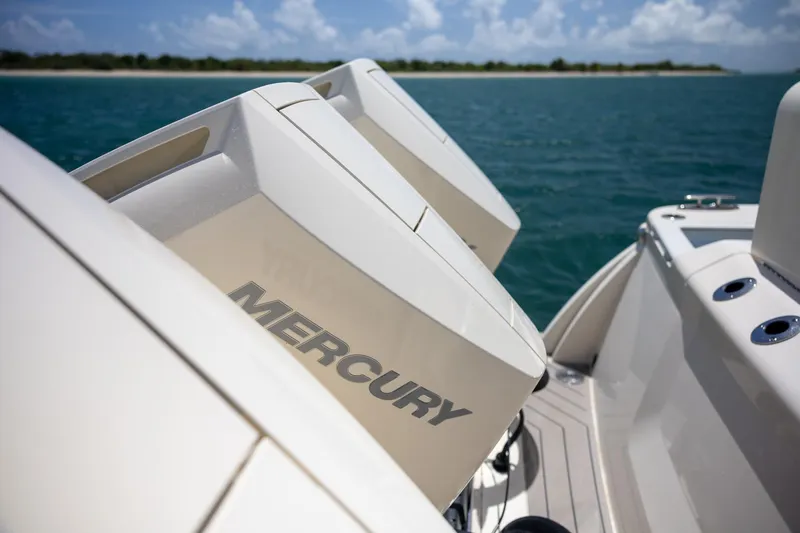 Slide: The Image of 2024 Scout 377 LXF boat with Mercury engines on open water. - 60