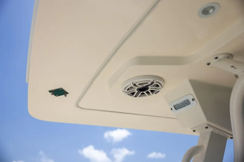 Slide: The Image of 2024 Scout 377 LXF boat ceiling with speaker and light against blue sky. - 62