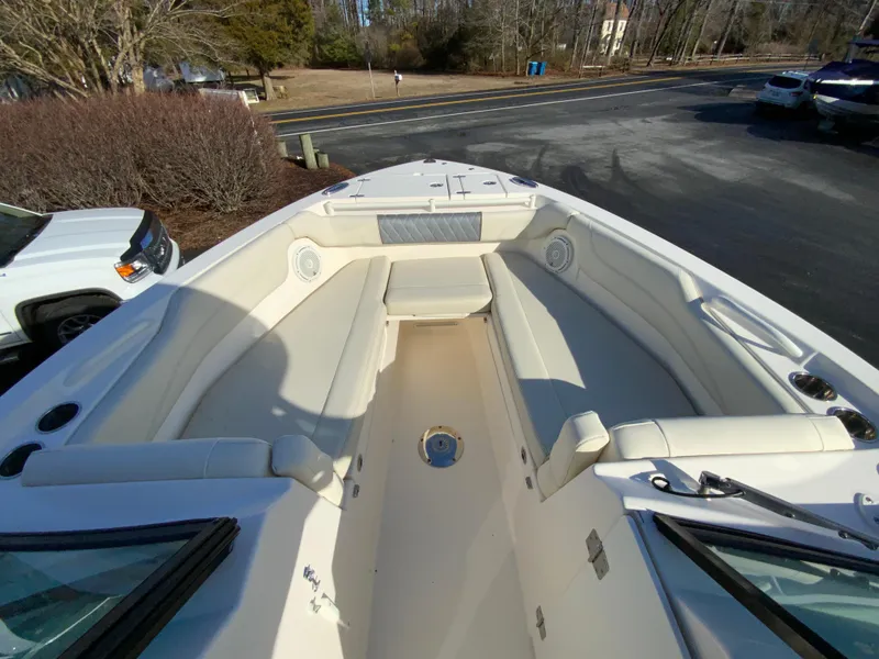 Slide: The Image of 2019 Cobia 280 Dual Console boat with spacious seating and sleek design. - 20