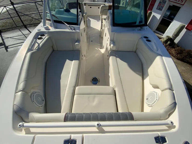 Slide: The Image of 2019 Cobia 280 Dual Console boat with spacious seating and modern design. - 24