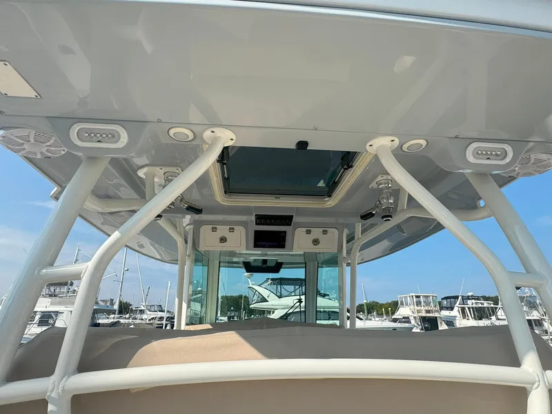 Slide: The Image of 2019 Sailfish 360 CC boat interior with overhead view of console and support structures. - 22