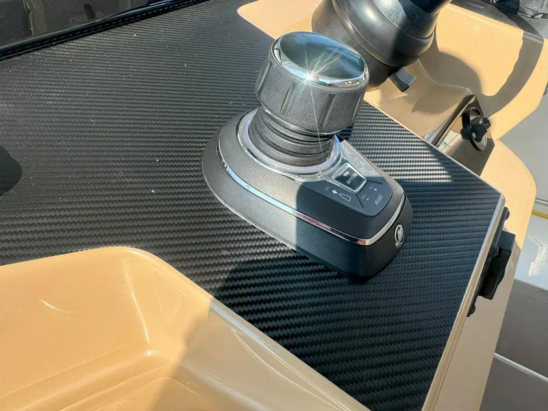 Slide: The Image of Close-up of 2019 Sailfish 360 CC boat control panel with joystick. - 32