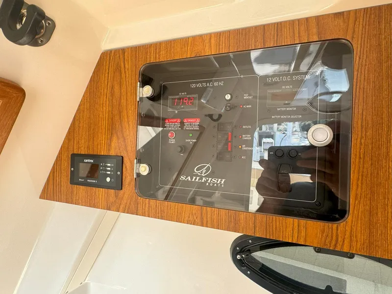 Slide: The Image of Control panel of 2019 Sailfish 360 CC boat with wood finish. - 39