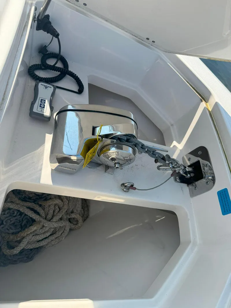 Slide: The Image of 2019 Sailfish 360 CC anchor compartment with rope and winch system. - 47