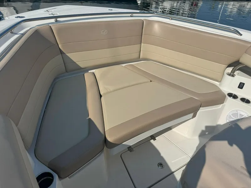 Slide: The Image of 2019 Sailfish 360 CC boat interior with beige cushioned seating. - 48