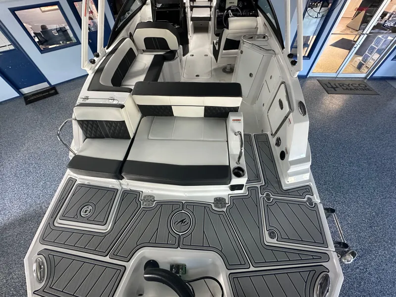Slide: The Image of 2025 Monterey M45 boat interior with spacious seating and modern design in showroom. - 12