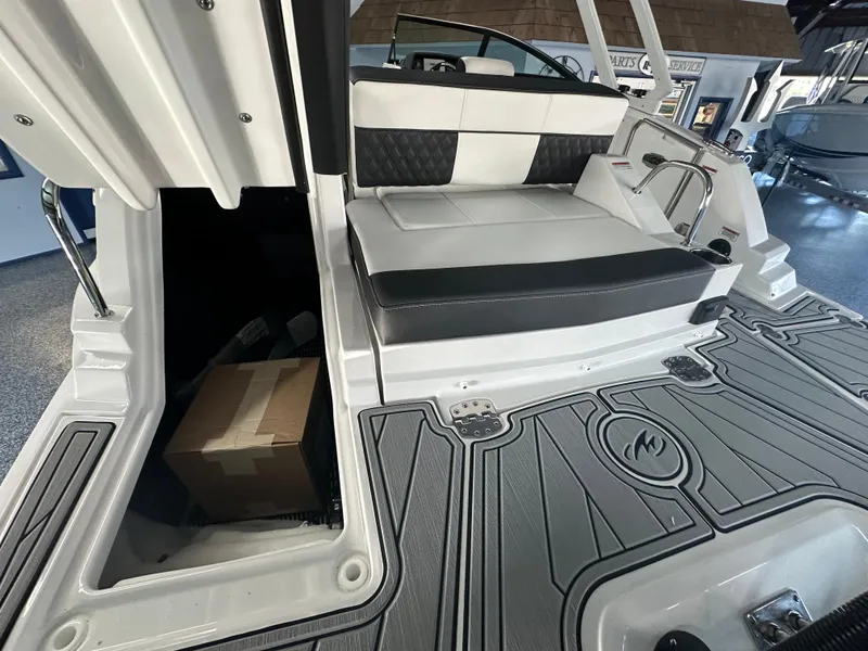 Slide: The Image of Interior of 2025 Monterey M45 boat, featuring sleek seating and modern control panel. - 14