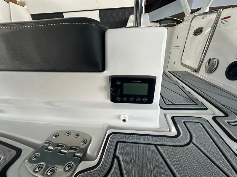 Slide: The Image of 2025 Monterey M45 boat detail showing electrical outlet and warning label. - 15