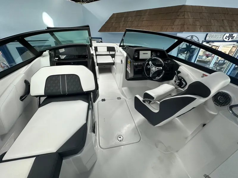 Slide: The Image of 2025 Monterey M45 boat cockpit with steering wheel and Simrad display. - 25