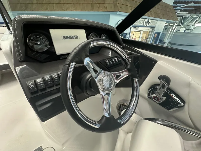 Slide: The Image of Dashboard of 2025 Monterey M45 boat with steering wheel and control panel. - 28