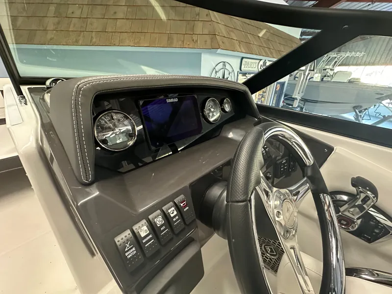 Slide: The Image of 2025 Monterey M45 boat interior with sleek dashboard and modern design. - 29