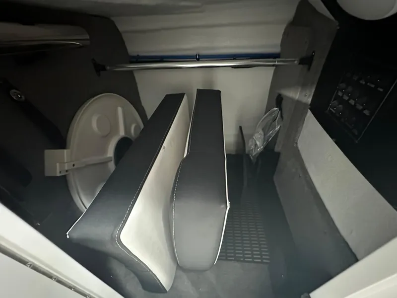 Slide: The Image of Interior seating of 2025 Monterey M45 boat, featuring black and white upholstery. - 35