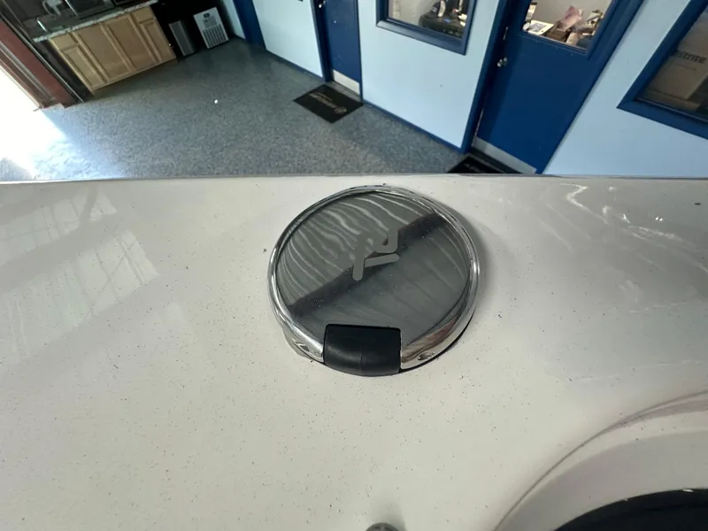 Slide: The Image of 2025 Monterey M45 boat deck with open fuel cap in a garage setting. - 40